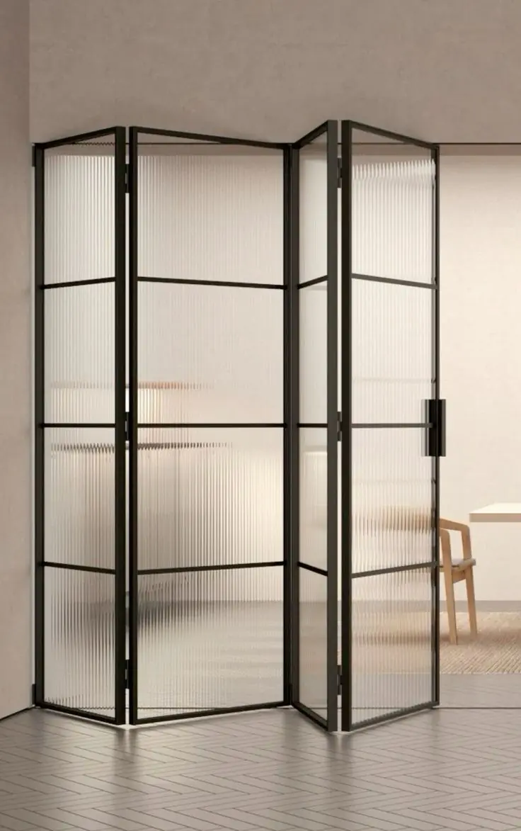 folding sliding doors opening a Dubai living room to a shaded patio