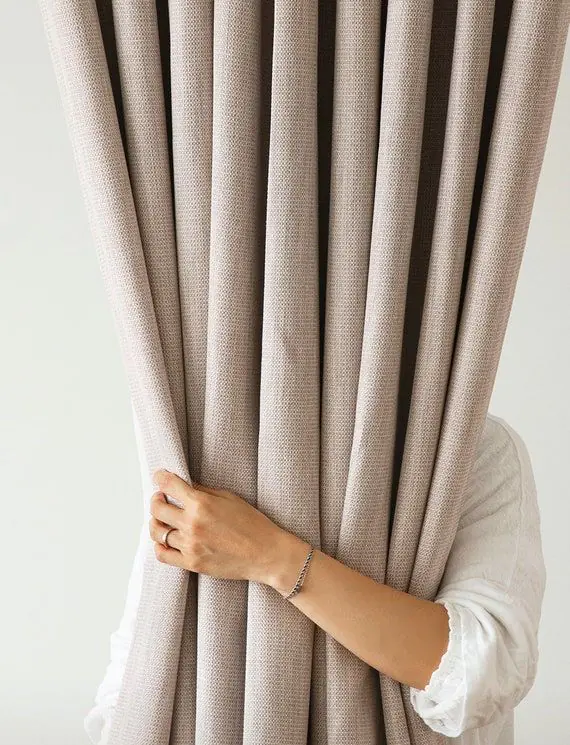 Apartment living room with Linen Curtains in Dubai softly filtering the afternoon sun