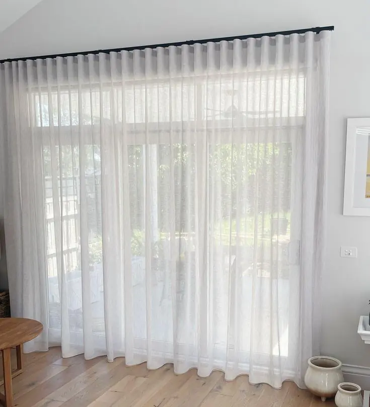 Sheer Curtains UAE Online softly filtering daylight in a Dubai living room Color Decisions, Fabric Care, and Everyday Living